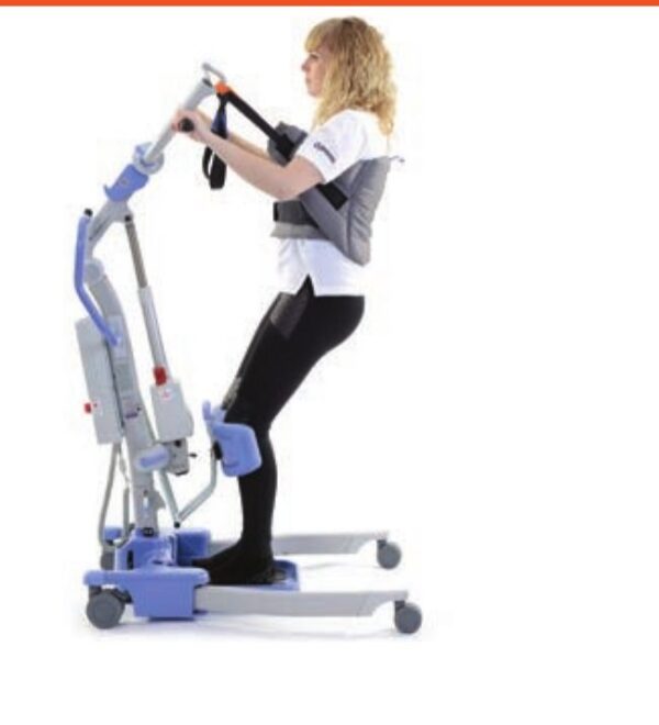 Disposable sit to stand sling by Joerns Hoyer supporting a patient on a Hoyer stand aid lift