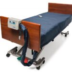 Lumex LS200 alternating pressure mattress with low air loss on a hospital bed with the pump on the footboard
