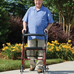 Walkabout Lite rollator in use on a garden path