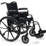 Everest & Jennings Traveler L4 wheelchair with flip-back desk arms and swing-away footrests
