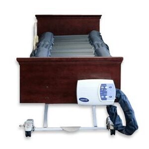 Joerns DermaFloat APL alternating pressure pump control unit hanging on the foot of the bed