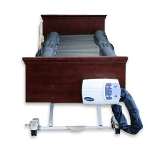 Joerns DermaFloat APL alternating pressure pump control unit hanging on the foot of the bed