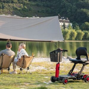VOCIC D91 portable scooter with basket at a lakeside campsite