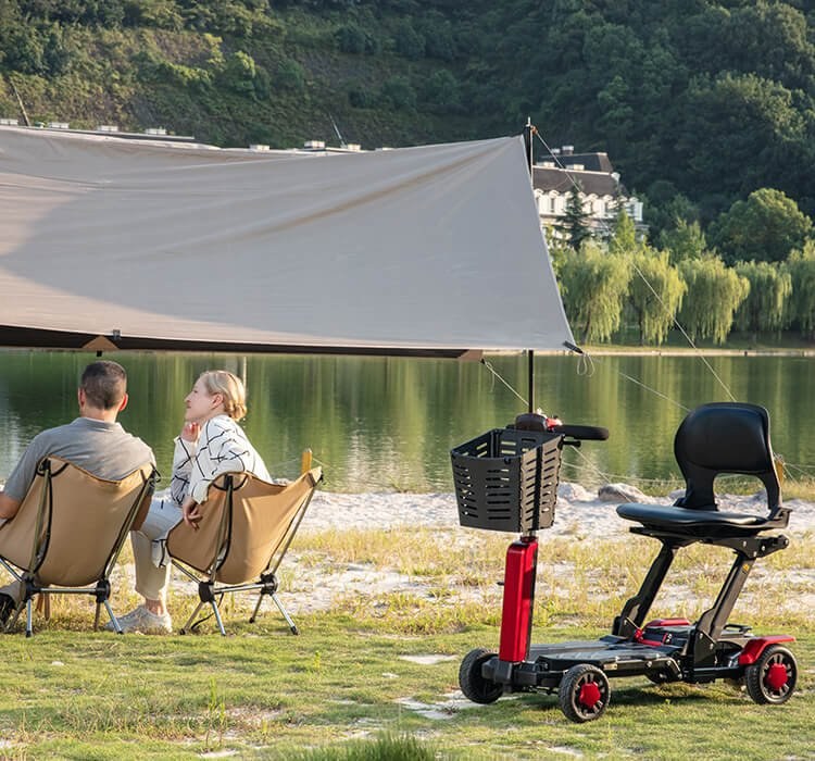 VOCIC D91 portable scooter with basket at a lakeside campsite