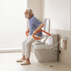 Senior man sitting on the VOCIC AX12 toilet lift seat holding the armrests