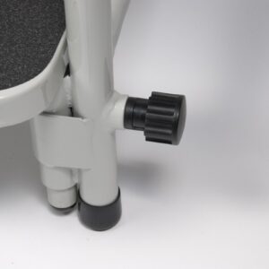 Spring-loaded footrest height knob on the Lumex hip chair