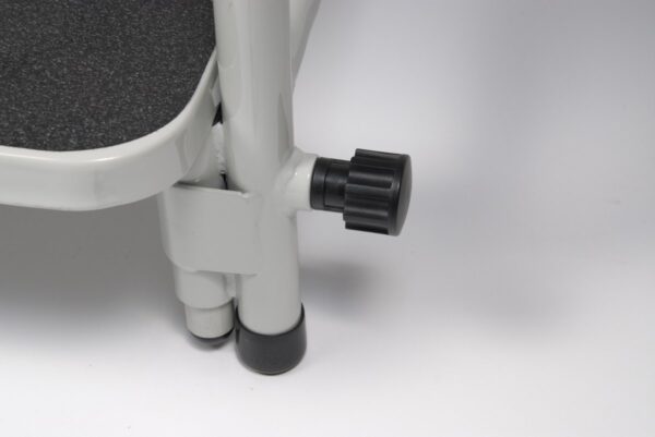 Spring-loaded footrest height knob on the Lumex hip chair