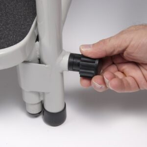 Adjusting the hip chair footrest height by pulling the knob
