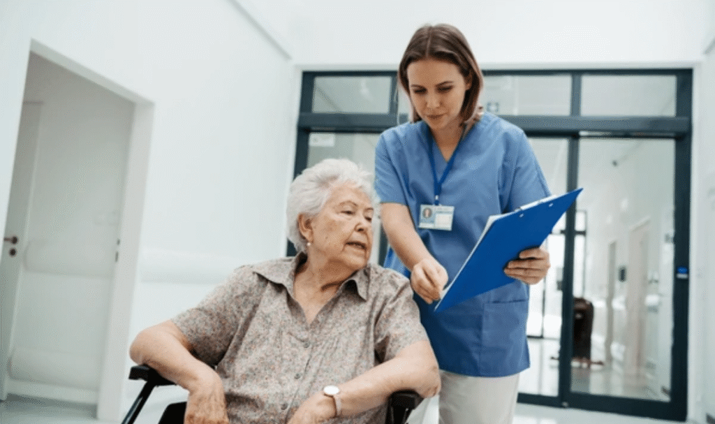 Family caregiver assisting elderly patient at home with hospital discharge planning checklist, mobility aids, and home safety equipment