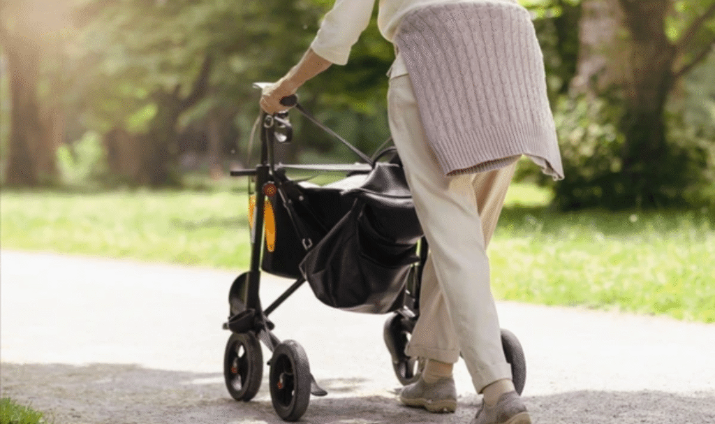 Elderly woman using mobility equipment for elderly at home with a rollator walker for safer and independent living