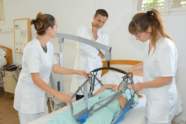 patient transfer devices are being used to transfer a patient from the bed to a wheelchair