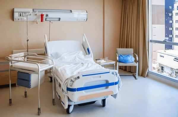 modern hospital beds for home use with electric adjustments, designed for elderly patients, featuring safety rails and a comfortable mattress.