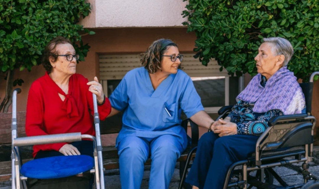 Elderly woman using home care equipment for seniors with caregiver support in living room