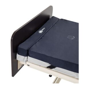 Medacure foam mattress extender gap filler at the foot of a hospital bed