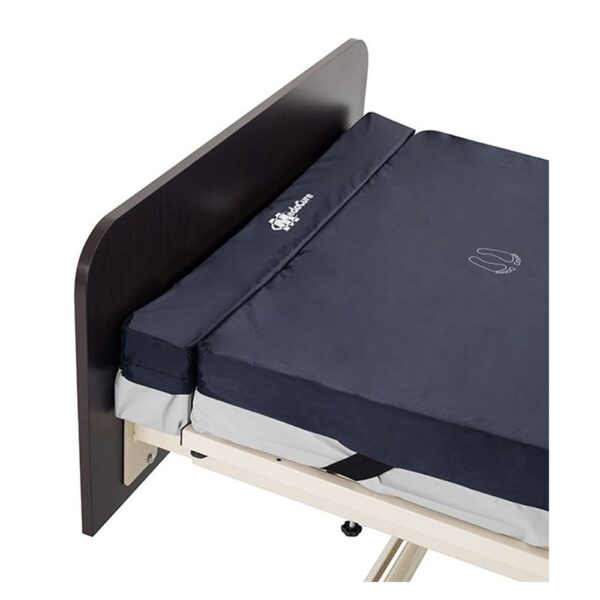 Medacure foam mattress extender gap filler at the foot of a hospital bed